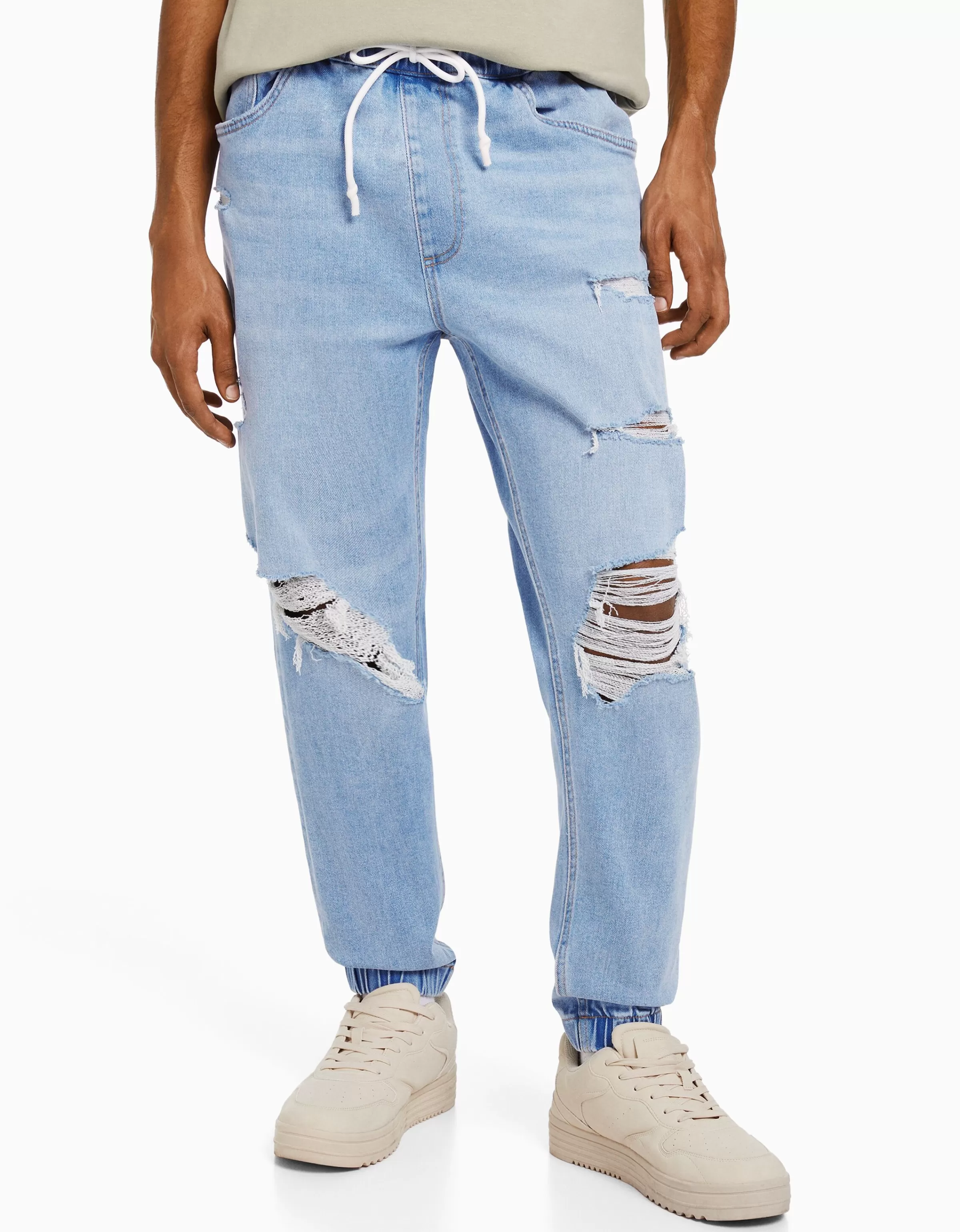 BERSHKA Jeans Jogger Confortevili con Strappi - Blu Denim Sfumato per Stile Urban Casual

(：，，