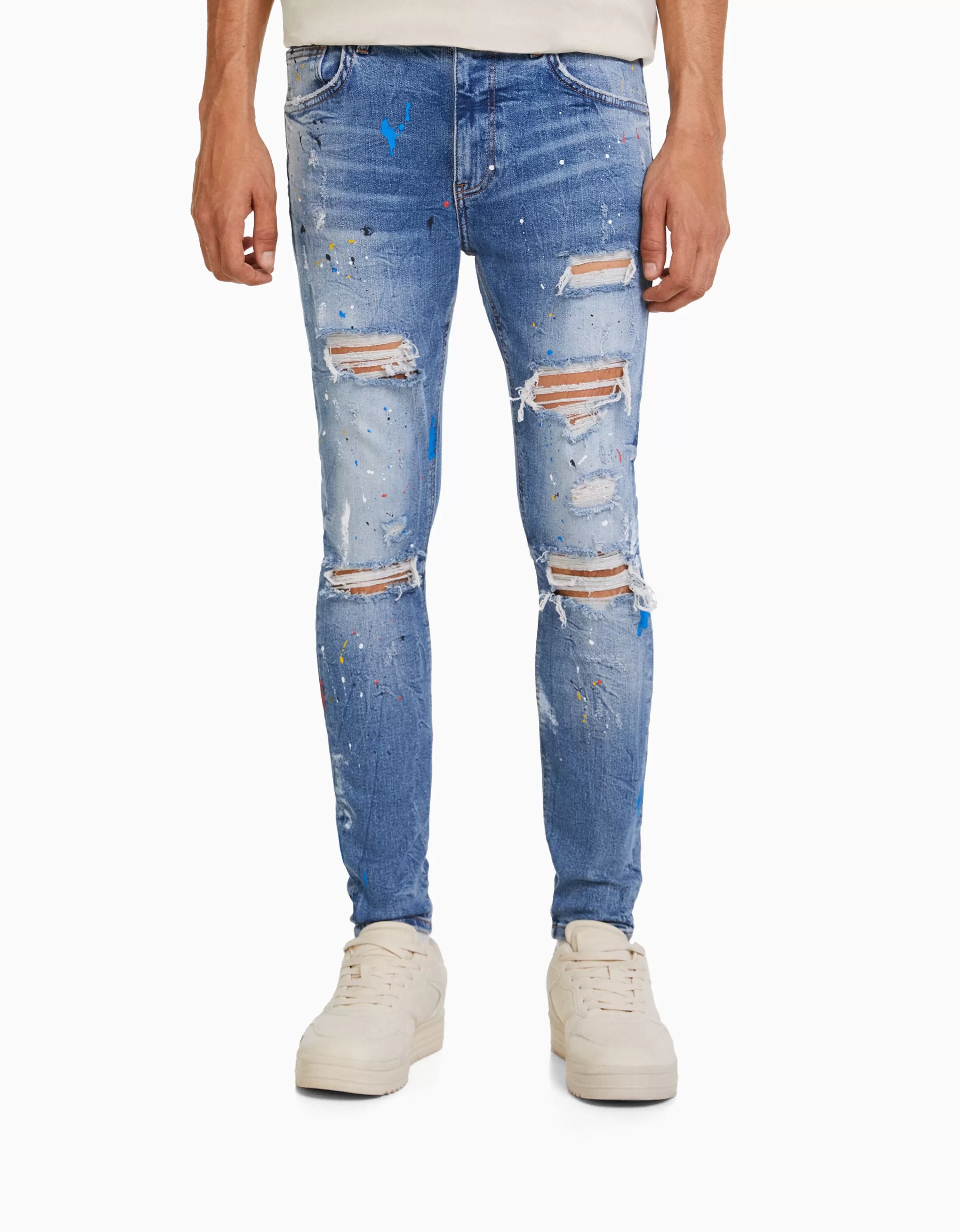 Jeans Skinny BERSHKA con Strappi Artigianali e Effetto Pittura - Blu Denim Lavato