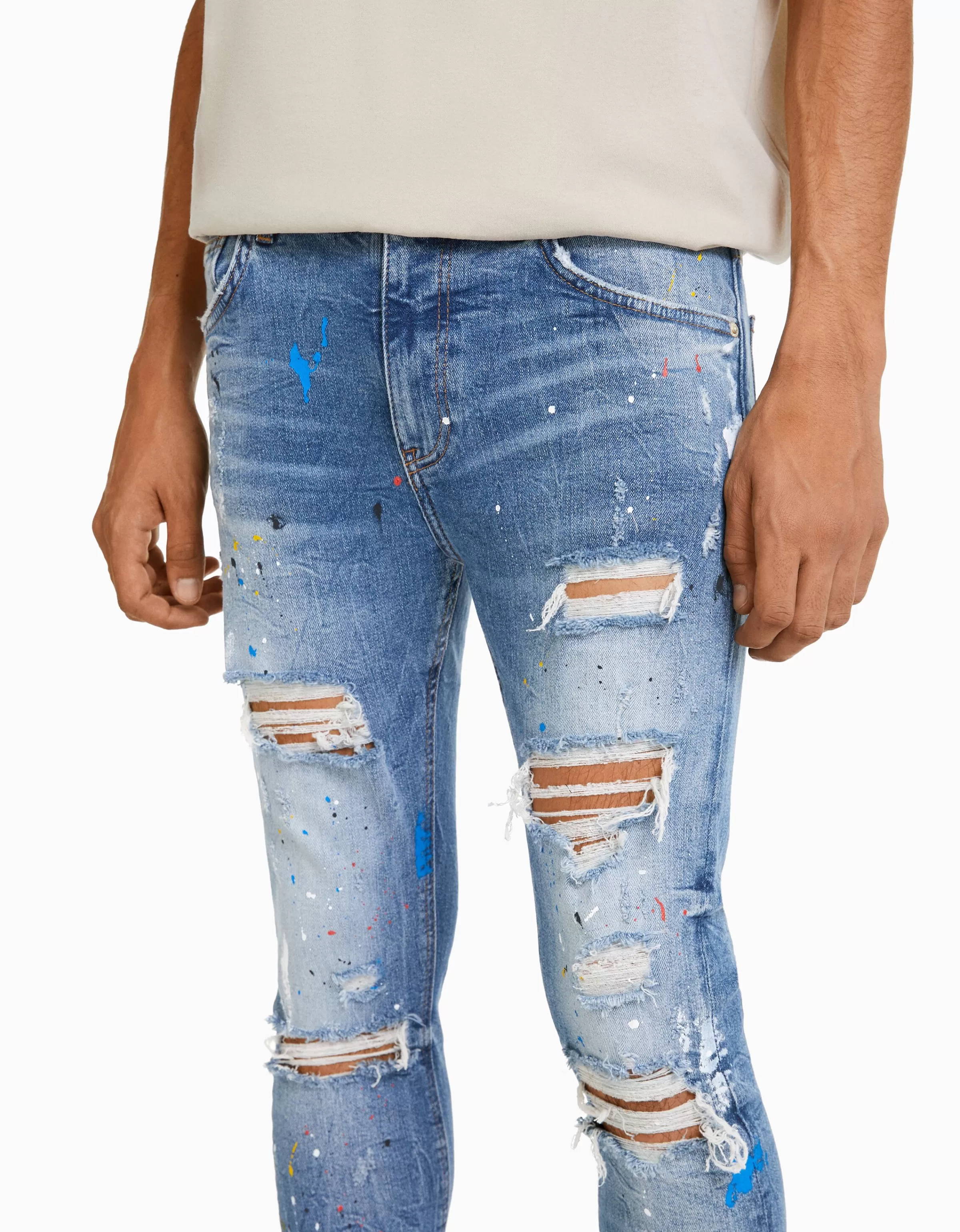 Jeans Skinny BERSHKA con Strappi Artigianali e Effetto Pittura - Blu Denim Lavato