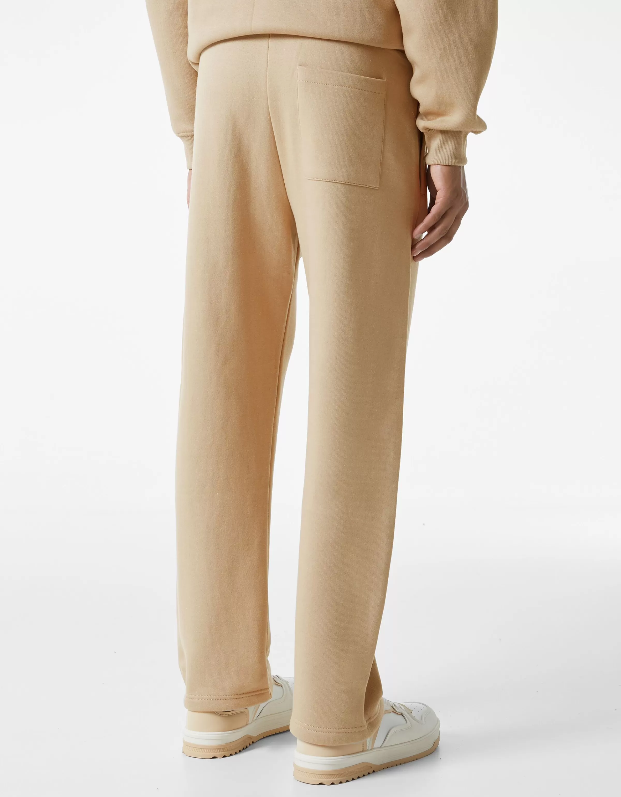 Pantaloni in pile a gamba larga Bershka - Tinta unita avorio chiaro per un look casual comodo